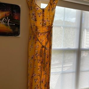 SIZE LARGE Yellow pink and green flowered jumpsuit.Flare bootcut.